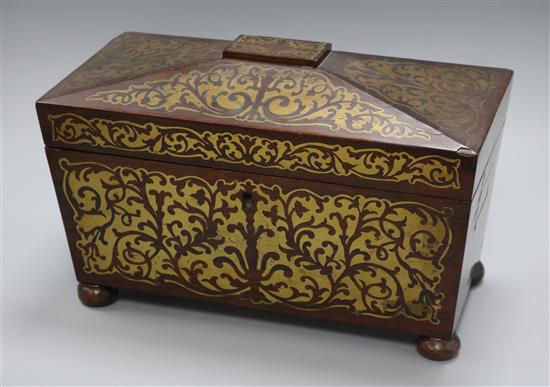 A Regency rosewood two-division tea caddy, of sarcophagus form inlaid with cut brasswork (two canisters, bowl deficient) length 32.5cm